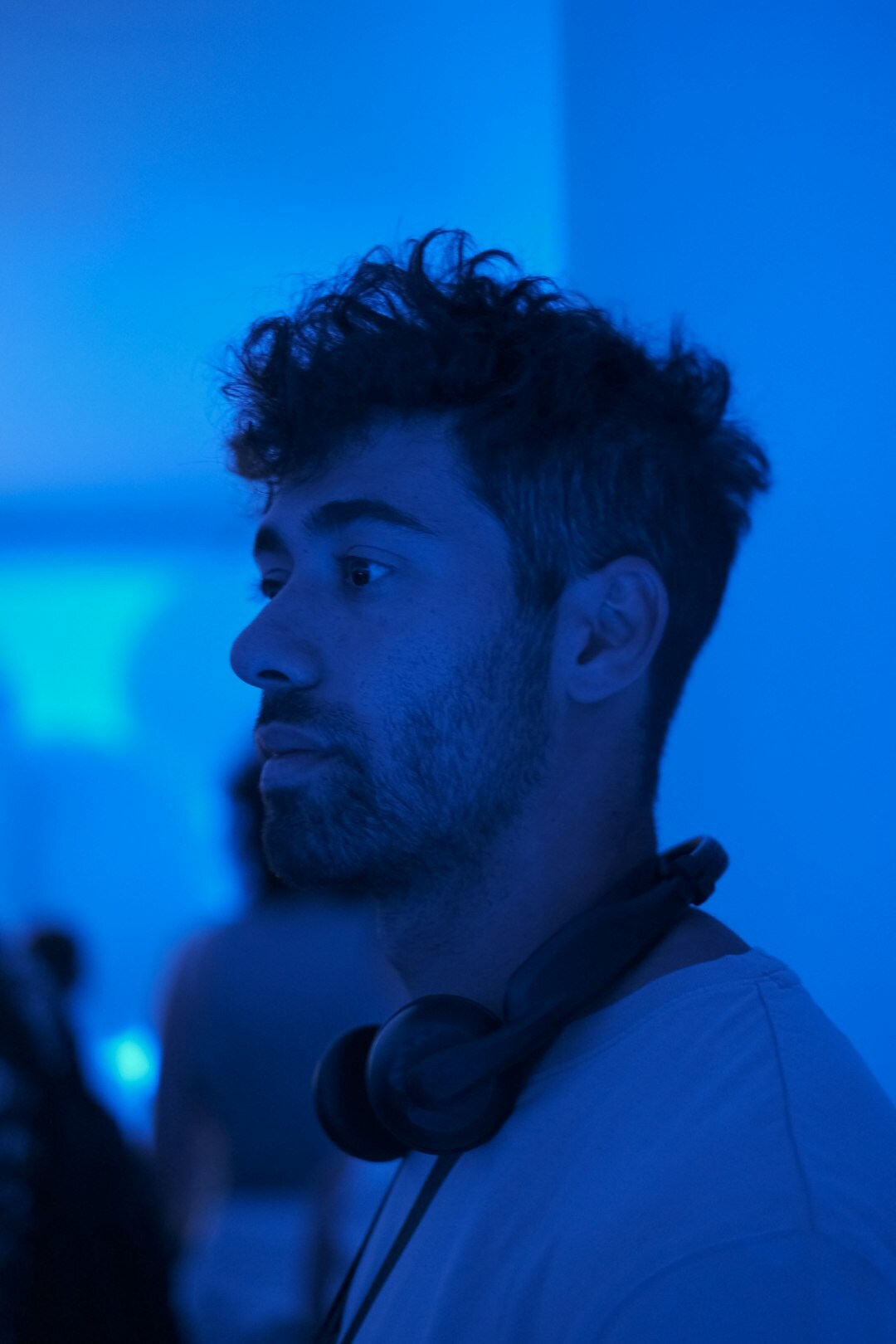 TV director wearing headset in control room