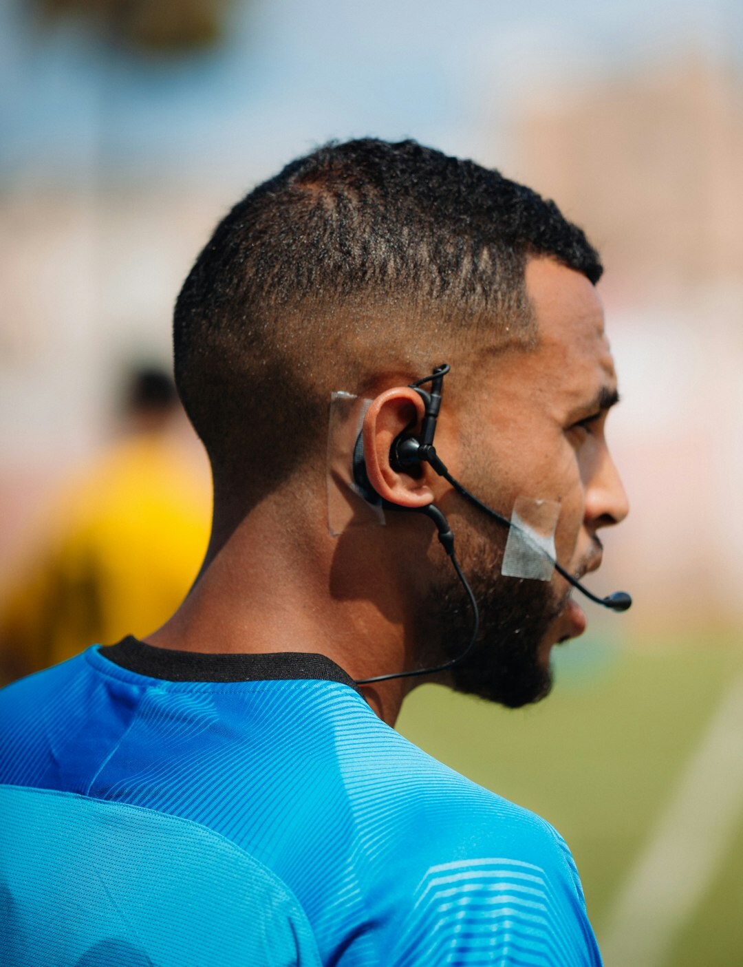Belgian media coach in studio with headset